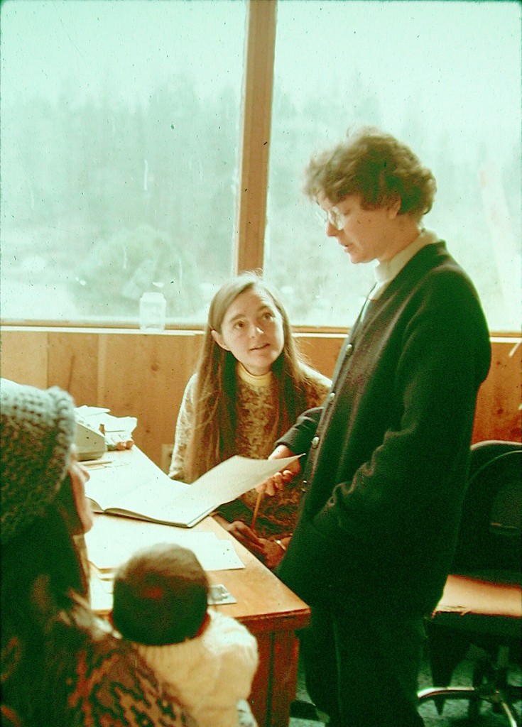 Seva and Asha confer in the publications building at Ananda Village.